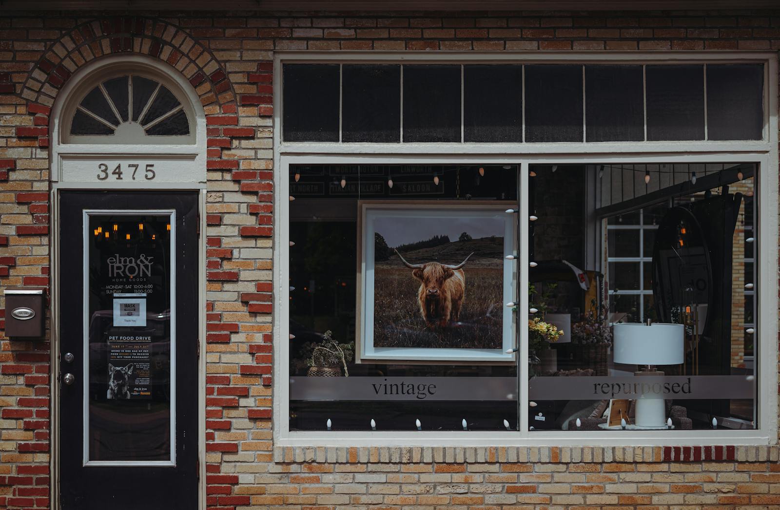 Clean brick storefront and sidewalk after professional commercial pressure washing