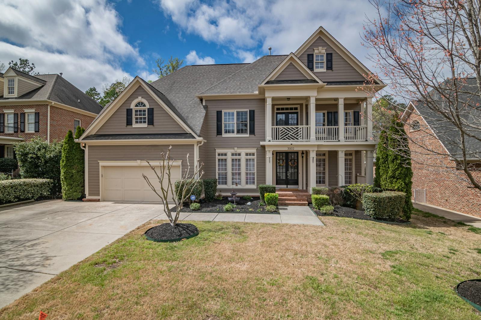 Clean dark asphalt shingle roof on a mid-Atlantic colonial home after soft wash